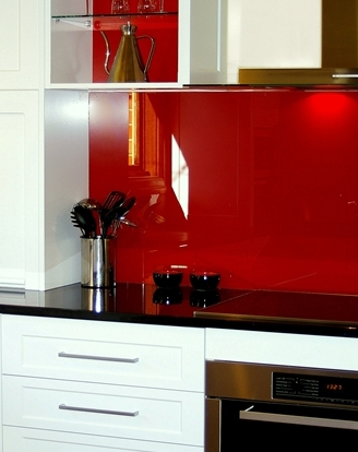 A White Two Pack Transitional Style Kitchen at McLaren Vale with Black Granite tops and Red Glass Splashbacks by Adelaide’s Compass Kitchens